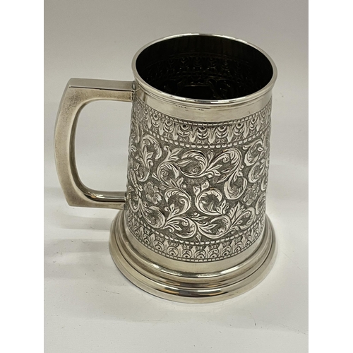 1 - A STERLING SILVER TANKARD WITH FOLIATE CHASED AND ENGRAVED DESIGN WITH VACANT CARTOUCHE, STAMPED TO ... 