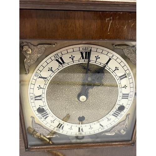 14 - A MAHOGANY ELLIOTT 8-DAY WESTMINSTER CHIMING BRACKET / MANTLE CLOCK WITH KEY