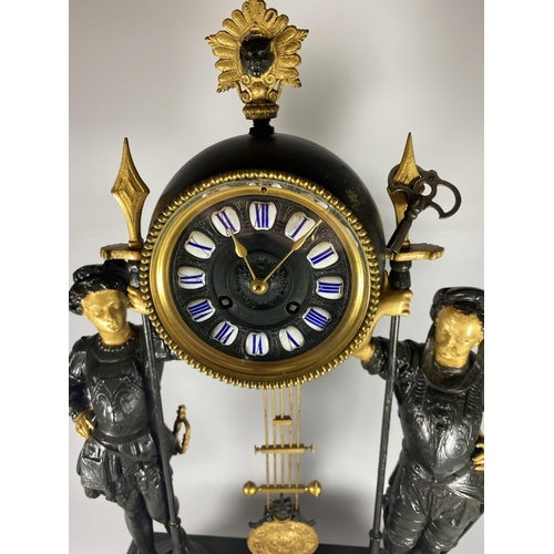 17 - A FRENCH JAPY FERERES SPELTER TWO TRAIN DOMED CLOCK WITH TWIN FIGURAL DESIGN, DOME HEIGHT 64CM, WITH... 