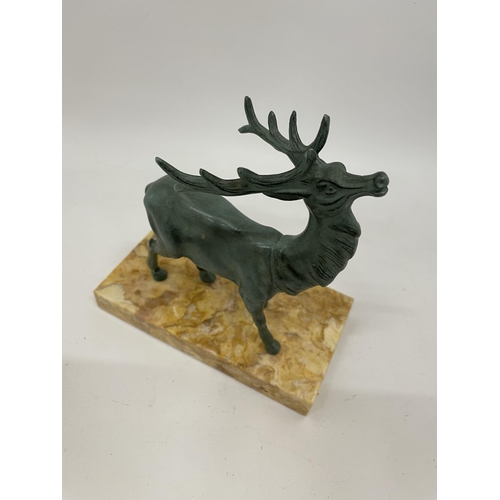 28 - AN ART DECO SPELTER MODEL OF A STAG ON MARBLE BASE