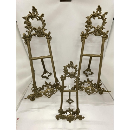 38 - THREE ORNATE VINTAGE BRASS TABLE TOP EASEL DISPLAYS, HEIGHT OF LARGE PAIR 53CM