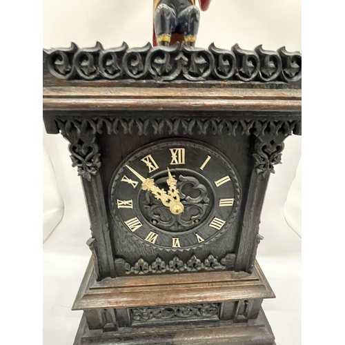 4 - AN EARLY 20TH CENTURY NOVELTY AUTOMATION CARVED DARK OAK MANTLE CLOCK WITH NAPOLEONIC MONKEY FIGURE ... 