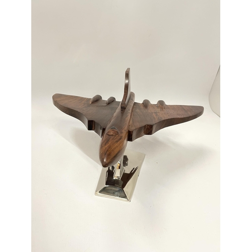 57 - A WOODEN MODEL OF A VULCAN BOMBER ON A CHROME BASE