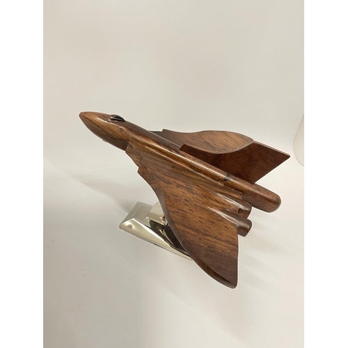 57 - A WOODEN MODEL OF A VULCAN BOMBER ON A CHROME BASE