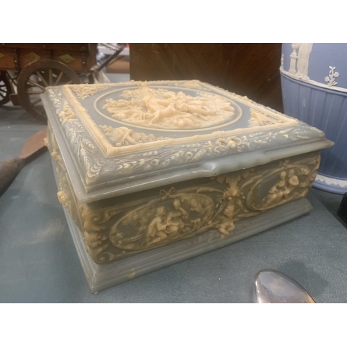 109 - A LARGE HEAVY JEWELLERY BOX WITH JASPERWARE STYLE DECORATION 23CM X 23CM X 9CM