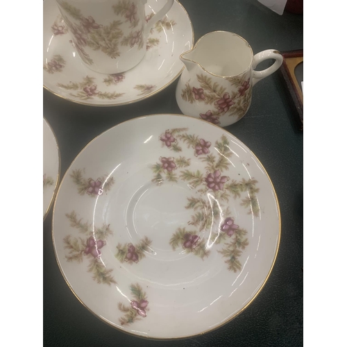 115 - A VINTAGE CHINA PART TEASET WITH PINK FLORAL PATTERN TO INCLUDE CUPS, SAUCERS, CREAM JUG AND A SUGAR... 