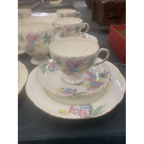 125 - A VINTAGE FOLEY CHINA TEASET TO INCLUDE A CAKE PLATE, CUPS, SAUCERS, SIDE PLATES, A CREAM JUG AND SU... 