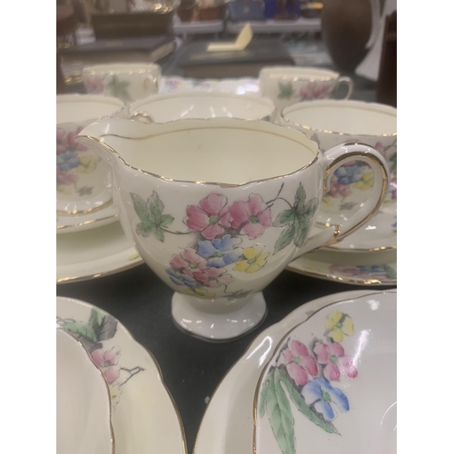 125 - A VINTAGE FOLEY CHINA TEASET TO INCLUDE A CAKE PLATE, CUPS, SAUCERS, SIDE PLATES, A CREAM JUG AND SU... 