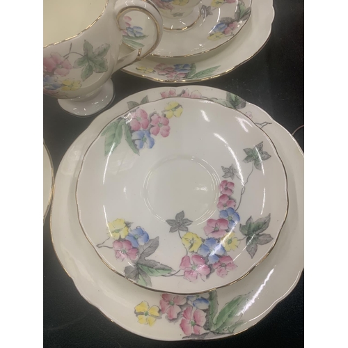 125 - A VINTAGE FOLEY CHINA TEASET TO INCLUDE A CAKE PLATE, CUPS, SAUCERS, SIDE PLATES, A CREAM JUG AND SU... 