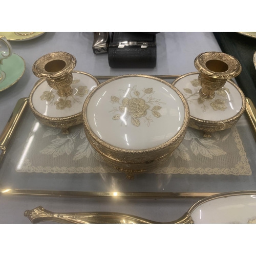 127 - A VINTAGE DRESSING TABLE SET TO INCLUDE A GLASS TRAY, CANDLESTICKS, TRINKET BOX, BRUSHES AND HAND MI... 