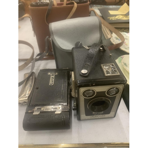 128 - A VINTAGE NO 1 KODAK CAMERA, A KODAK BROWNIE IN CASE, A HOHNER HARMONICA AND A PAIR OF EUBECCO NAVIG... 