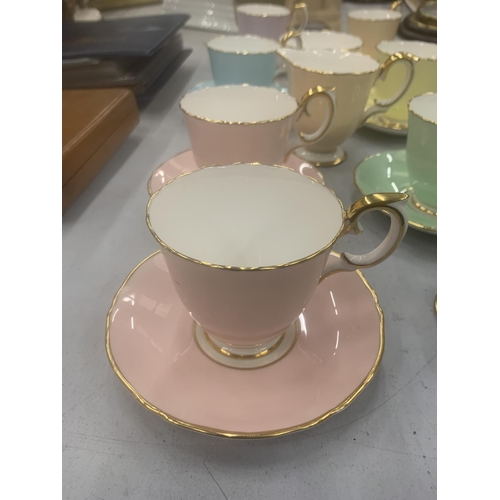 130 - A QUANTITY OF CROWN STAFFORDSHIRE 'HARLEQUIN' CUPS, SAUCERS, CREAM JUGS AND SUGAR BOWL