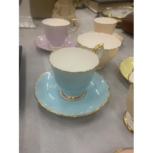 130 - A QUANTITY OF CROWN STAFFORDSHIRE 'HARLEQUIN' CUPS, SAUCERS, CREAM JUGS AND SUGAR BOWL