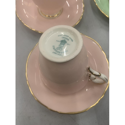 130 - A QUANTITY OF CROWN STAFFORDSHIRE 'HARLEQUIN' CUPS, SAUCERS, CREAM JUGS AND SUGAR BOWL