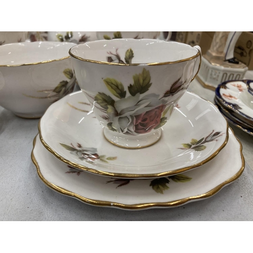 153 - A ROYAL VALE TEASET WITH ROSE DECORATION TO INCLUDE A CAKE PLATE, CUPS, SAUCERS, SIDE PLATES, CREAM ... 