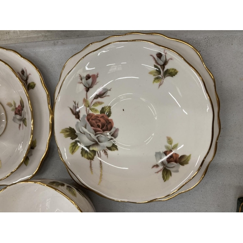 153 - A ROYAL VALE TEASET WITH ROSE DECORATION TO INCLUDE A CAKE PLATE, CUPS, SAUCERS, SIDE PLATES, CREAM ... 