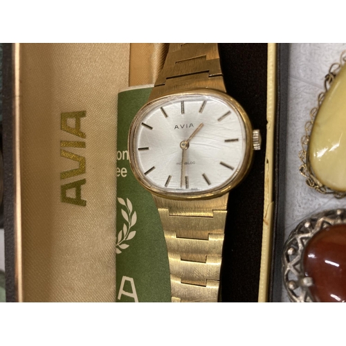 155 - AN AVIA WRISTWATCH BOXED PLUS THREE BROOCHES, TWO WITH STONES