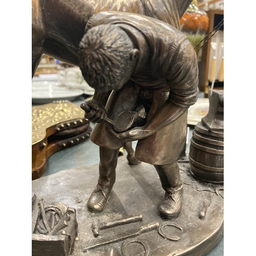 188 - A VINTAGE BRONZE EFFECT MODEL OF A BLACKSMITH WITH HORSE