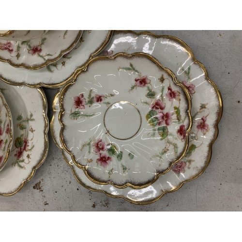 218 - AN ANTIQUE DIAMOND CHINA TEASET TO INCLUDE A LARGE NUMBER OF TRIOS, TWO CAKE PLATES, A CREAM JUG AND... 