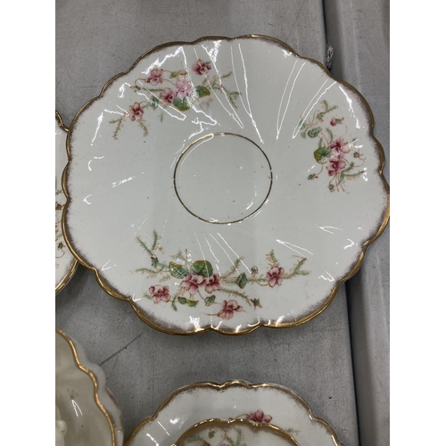 218 - AN ANTIQUE DIAMOND CHINA TEASET TO INCLUDE A LARGE NUMBER OF TRIOS, TWO CAKE PLATES, A CREAM JUG AND... 