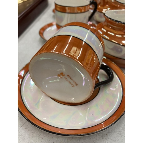 220 - A VINTAGE STYLE ORANGE, CREAM AND BLACK LUSTRE COFFEE SET TO INCLUDE A COFFEE POT, CREAM JUG, SUGAR ... 