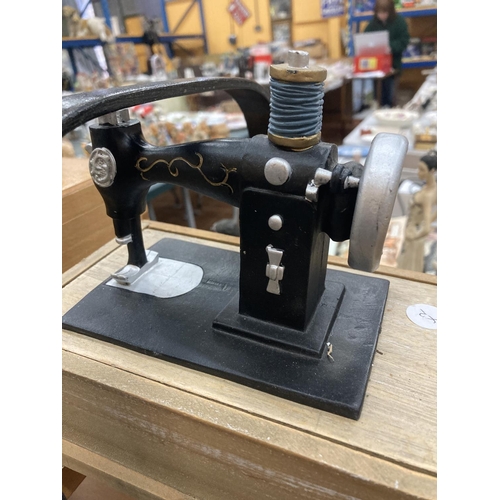 236 - A VINTAGE CANTILEVER SEWING BOX PLUS A SEWING BOX WITH A MODEL SEWING MACHINE ON TOP