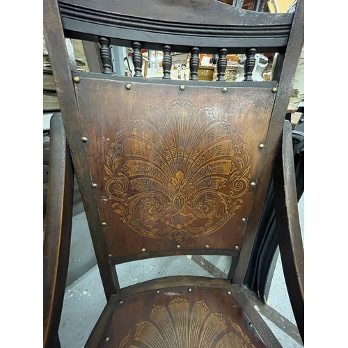 100 - AN ART NOUVEAU CHAIR WITH FLORAL DESIGN SEAT AND BACK