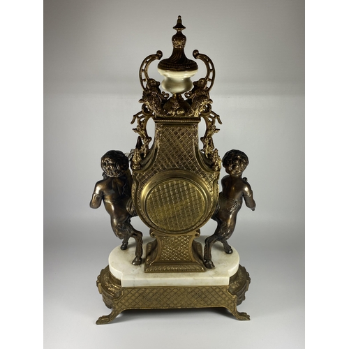 61 - A C.1900 ITALIAN REPRODUCTION MANTLE CLOCK BY IMPERIAL IN BRASS WITH MARBLE BASE AND CHERUBS, HEIGHT... 