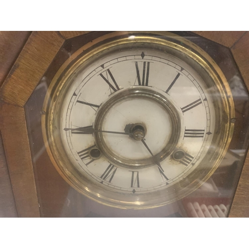 261 - A VINTAGE MAHOGANY CASED MANTLE CLOCK WITH FLORAL DECORATED GLASS DOOR, TO INCLUDE PENDULUM AND KEY ... 