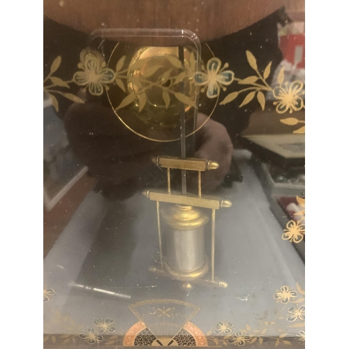 261 - A VINTAGE MAHOGANY CASED MANTLE CLOCK WITH FLORAL DECORATED GLASS DOOR, TO INCLUDE PENDULUM AND KEY ... 