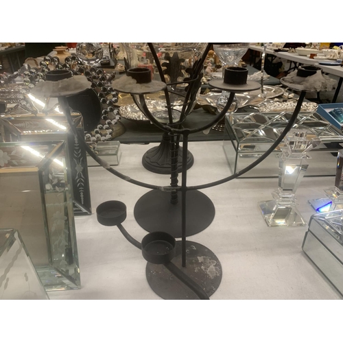 292 - A LARGE GLASS BOWL ON A METAL STAND, A TWO BRANCHED CANDLE HOLDER WITH GLASS HOLDERS, TWO OTHER META... 