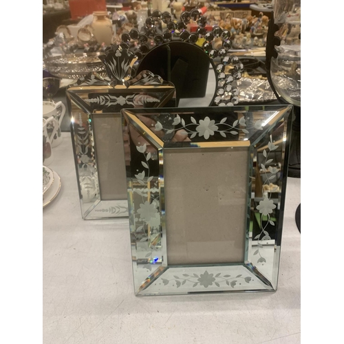 293 - A MODERN TABLE TOP MIRROR WITH CRYSTAL DECORATION, TWO MIRRORED PHOTO FRAMES AND A TISSUE BOX HOLDER