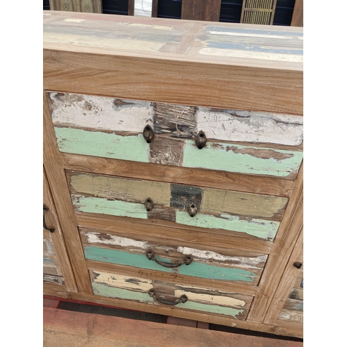 3580 - A PAINTED INDIAN HARDWOOD SIDEBOARD WITH TWO DOORS AND FOUR DRAWERS