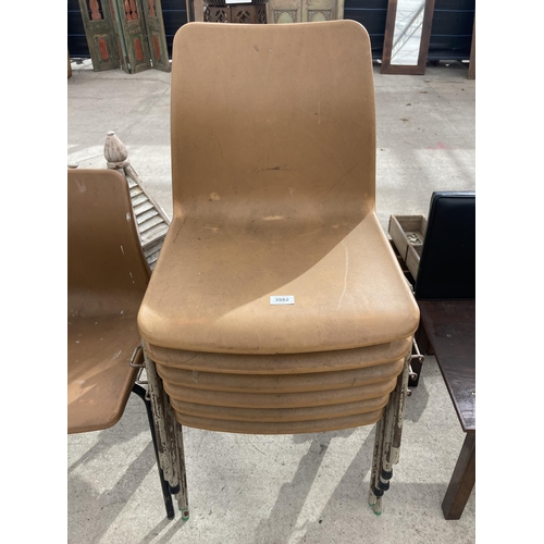 3582 - SEVEN BROWN PLASTIC STACKING CHAIRS