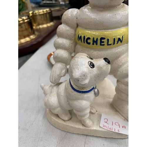 219A - A CAST MODEL OF A MICHELIN MAN AND DOG HEIGHT 20CM