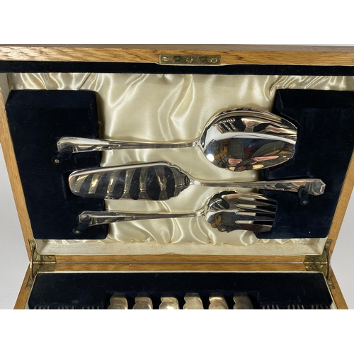 63 - AN ART DECO SILVER PLATED CANTEEN OF CUTLERY