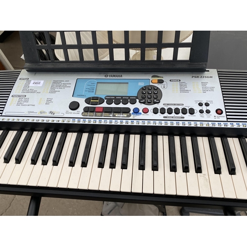 2402 - A YAMAHA ELECTRIC KEYBOARD AND STAND