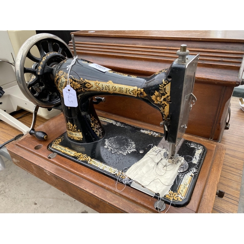 2405 - A VINTAGE SINGER SEWING MACHINE WITH WOODEN CARRY CASE