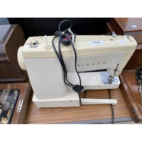 2406 - AN ELECTRIC SINGER SEWING MACHINE WITH FOOT PEDAL