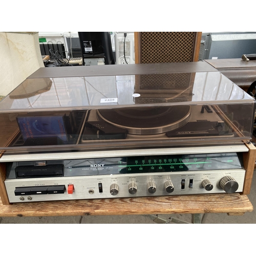 2409 - A SONY STEREO MUSIC SYSTEM RECORD DECK AND TWO WOODEN CASED SONY SPEAKERS