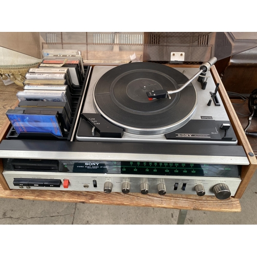 2409 - A SONY STEREO MUSIC SYSTEM RECORD DECK AND TWO WOODEN CASED SONY SPEAKERS