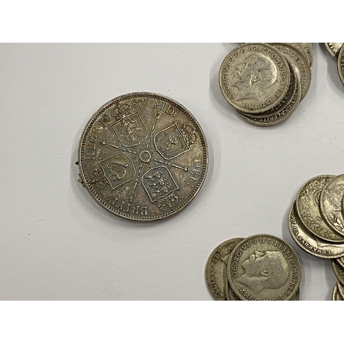 373 - A LEATHER WALLET OF MAINLY PRE 1920 SILVER THREEPENCES AND A VICTORIAN 1887 COIN BROOCH