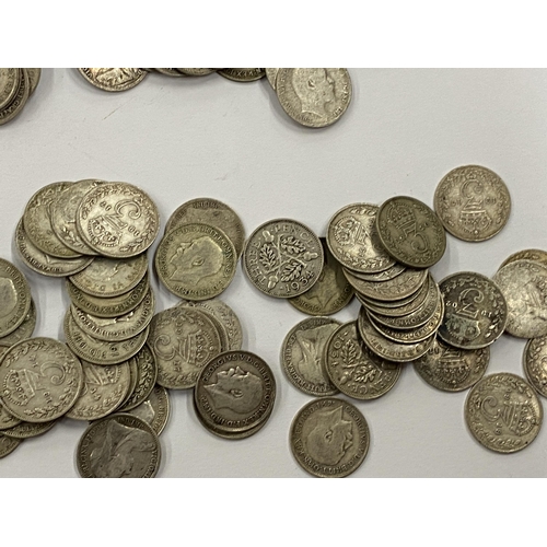 373 - A LEATHER WALLET OF MAINLY PRE 1920 SILVER THREEPENCES AND A VICTORIAN 1887 COIN BROOCH