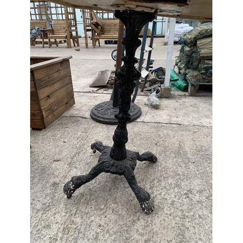 51 - A PUB TABLE WITH WOODEN TOP AND CAST IRON TABLE BASE (79CM x 79CM) NO VAT