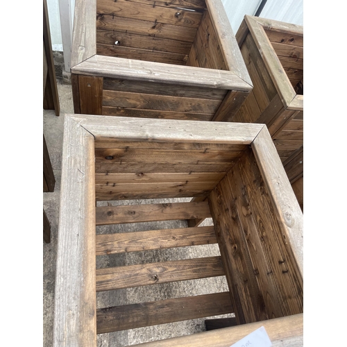 133 - TWO LARGE WOODEN PLANTERS ON LEGS NO VAT