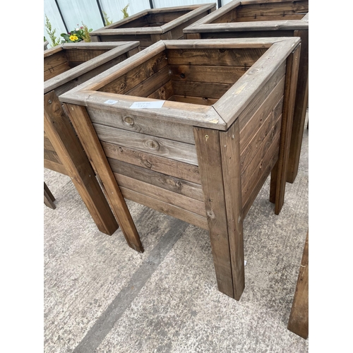 133 - TWO LARGE WOODEN PLANTERS ON LEGS NO VAT