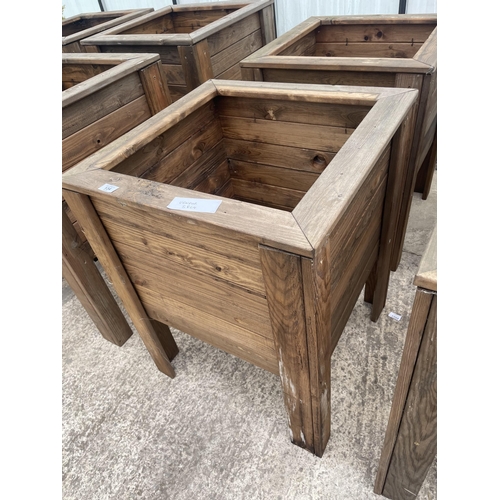 134 - TWO LARGE WOODEN PLANTERS ON LEGS NO VAT