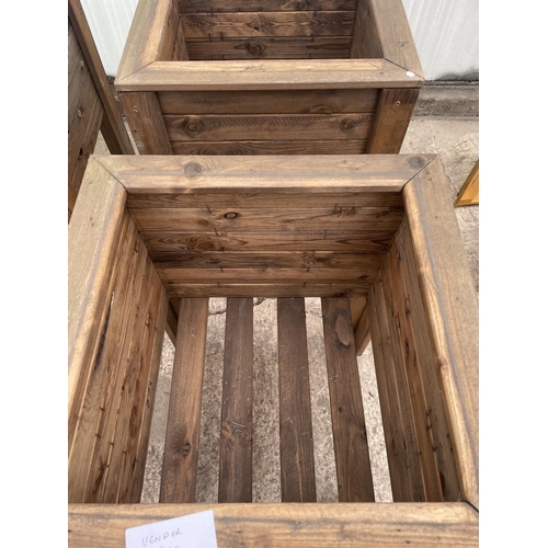 136 - TWO LARGE WOODEN PLANTERS ON LEGS NO VAT