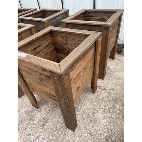 136 - TWO LARGE WOODEN PLANTERS ON LEGS NO VAT