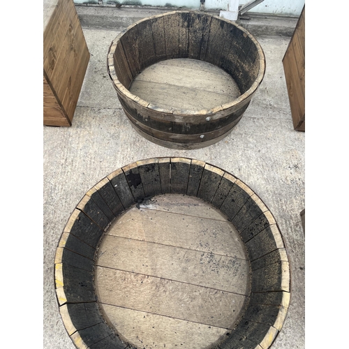 144 - TWO HALF BARREL PLANTERS NO VAT